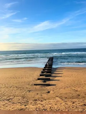 a group of steps in the sand on a beach at Charming Apartment Residence Ocean Park Pool, Sea in Aïn Harrouda