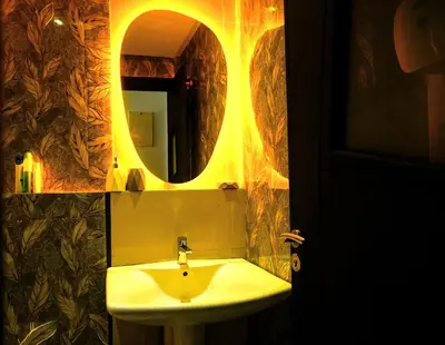 a bathroom with a sink and a mirror at Modern Apart Heart of Casablanca Perfect Location in Oulad Akkou
