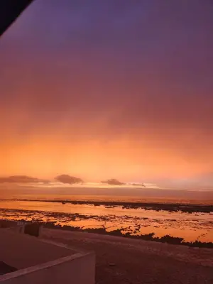 a view of the ocean at sunset at Joumaira beach in Temara