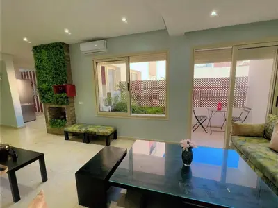 a living room with a couch and a table at Casa Stay in Casablanca