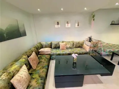 a living room with a couch and a table at Casa Stay in Casablanca