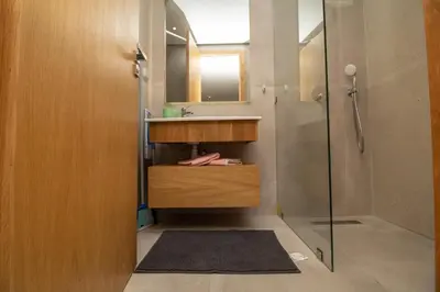 a bathroom with a sink and a shower at Studio Palmier Casablanca in Maarif