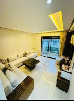 a living room with a couch and a table at Chic studio Casablanca in Casablanca