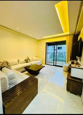 a living room with a couch and a table at Chic studio Casablanca in Casablanca
