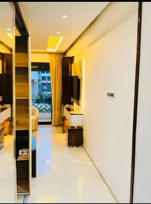 a living room with a television and a bedroom at Chic studio Casablanca in Casablanca