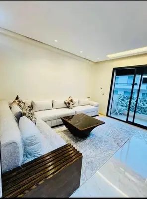 a living room with a couch and a coffee table at Chic studio Casablanca in Casablanca