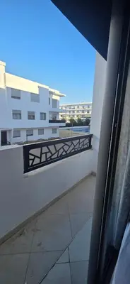 a balcony with a view of a building at appartement a louer sable d'or mansouria in Pont Blondin