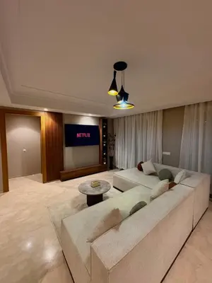 a living room with a couch and a tv at Smile City Homes in Casablanca