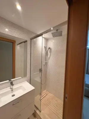 a bathroom with a shower with a sink and a shower at Smile City Homes in Casablanca
