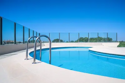 a swimming pool with a fence around it at Exceptional Penthouse Private Terrace & Pool in Bouznika