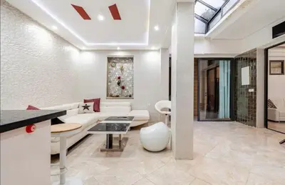 a living room with a white couch and a table at luxury apartment in casablanca in Maarif
