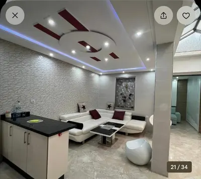 a living room with a couch and a table at luxury apartment in casablanca in Maarif