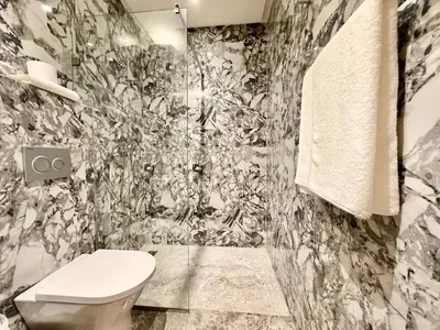 a black and white bathroom with a toilet and a shower at Calm Studio in Oasis, Near Train Station in Casablanca
