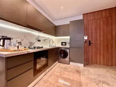 a kitchen with a washer and a dishwasher at Oasis Studio - Parking, Fiber, Near the Station in Casablanca