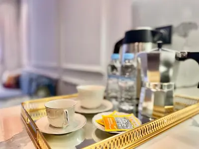 a tray with cups and saucers on a counter at Oasis Studio - Parking, Fiber, Near the Station in Casablanca