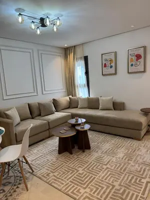 a living room with a couch and two tables at Modern Studio France ville in Casablanca
