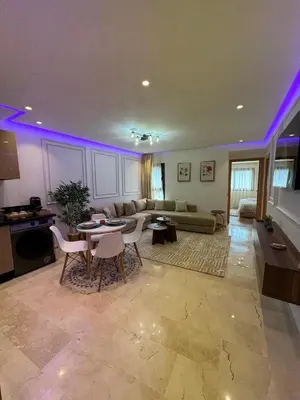 a living room with a couch and a table and chairs at Modern Studio France ville in Casablanca
