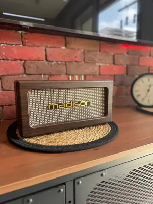 a radio sitting on top of a counter with a clock at Studio Zenata Central Park Près de la plage Vue Piscine in Aïn Harrouda