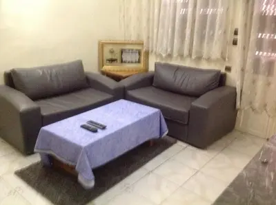 a living room with two couches and a coffee table at Appartement Familial Emile Zola in Casablanca