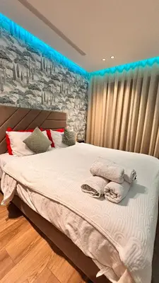 a bedroom with a bed with two towels on it at Castilo in Casablanca