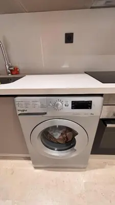 a washing machine in a kitchen with a counter at Castilo in Casablanca