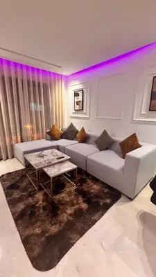 a living room with a white couch and a table at Castilo in Casablanca