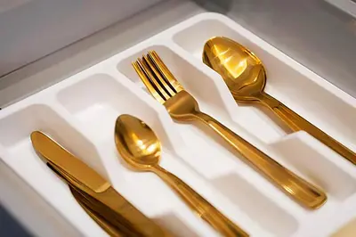 a white tray with gold utensils on it at MAYA SUITES - Corniche Seaside in Casablanca