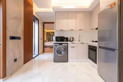 a kitchen with a washing machine in the middle at MAYA SUITES - Corniche Seaside in Casablanca
