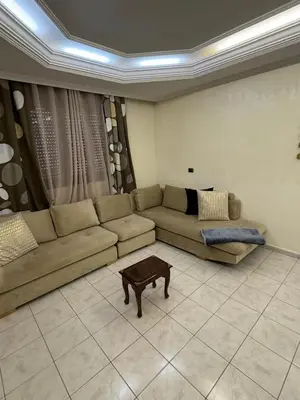 a living room with a couch and a coffee table at Luxury apartment 100 m2 in Mohammedia in Mohammedia