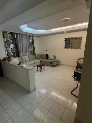 a living room with a couch and a table at Luxury apartment 100 m2 in Mohammedia in Mohammedia