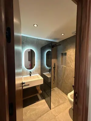 a bathroom with a sink and a toilet and mirror at Studio de luxe, lumineux et parfait in Casablanca