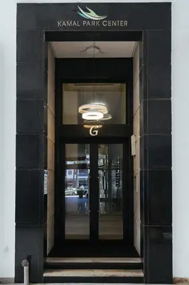 a entrance to a building with a black door at Charming Modern Studio near Corniche Mohammedia in Mohammedia