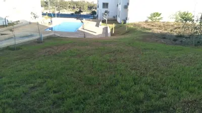 a yard with a swimming pool next to a house at Seaside 3 bedrooms apartment in Mansouria near Sablette Beach Mohammadia in Pont Blondin