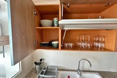 a kitchen with a sink and some glass jars at Elegant & Chic 2 Bedrooms - Maarif in Casablanca