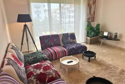 a living room with a couch and a table at Elegant & Chic 2 Bedrooms - Maarif in Casablanca