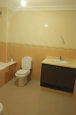 a bathroom with a toilet and a sink at Marina beach in Mohammedia