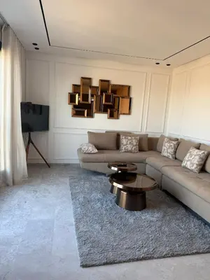 a living room with a couch and a coffee table at Metropoleparc luxury apparthotel in Casablanca