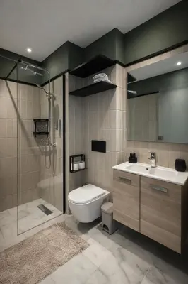 a bathroom with a toilet and a sink and a shower at Cedar Stays Appartement 1 chambre salon, parking, climatisation, Wifi, balcon in Casablanca