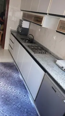 a kitchen with a stove and a counter top at Appartement ville des roses in Mohammedia