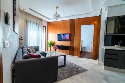 a living room with a couch and a table at Modern and cozy studio Close to CFC & Maarif in Casablanca