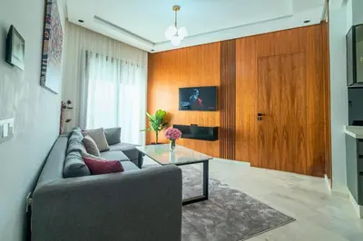 a living room with a couch and a table at Modern and cozy studio Close to CFC & Maarif in Casablanca