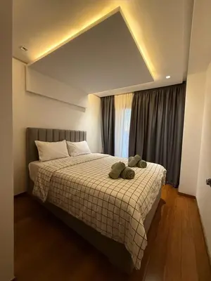 a bedroom with a bed with two stuffed animals on it at Chez BÉA in Rabat