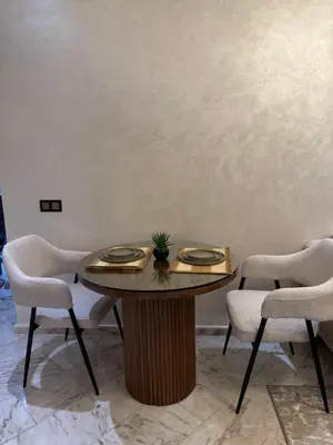 a table with a plant on it in a room at Chez BÉA in Rabat