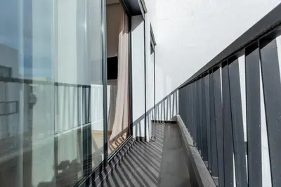 a balcony of a building with glass walls at Modern & Calm Studio in Casablanca