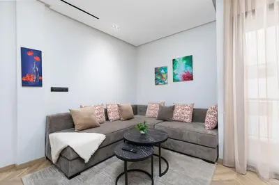 a living room with a couch and a table at Modern & Calm Studio in Casablanca