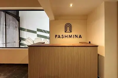 a reception desk in a building with a sign on it at Résidence Pashmina in Maarif
