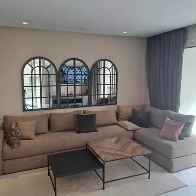 a living room with a couch and a coffee table at Zen Stay Appart in Casablanca