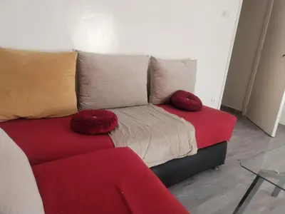 a couch with pillows on it in a living room at Sense house prime in Rabat