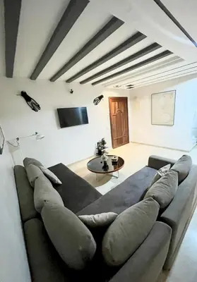 a living room with a couch and a table at Le repos parfait in Casablanca