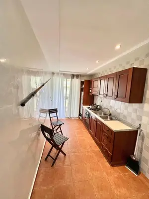 a kitchen with two chairs and a counter in it at Le repos parfait in Casablanca